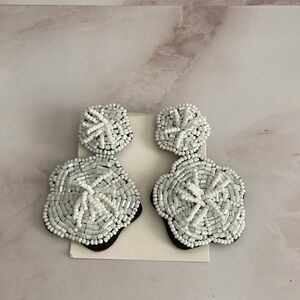 new bebe beaded white flower earrings with faux leather.